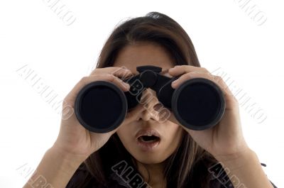 astonished female watching through binocular