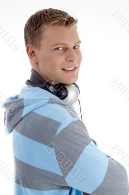 american man holding headphones around his neck