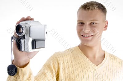 portrait of blonde man with handy cam