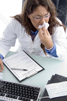 doctor cleaning her lips with napkin