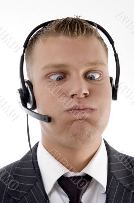 young man pulling a funny face with squinted eyes