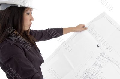 female architect looking at blueprints