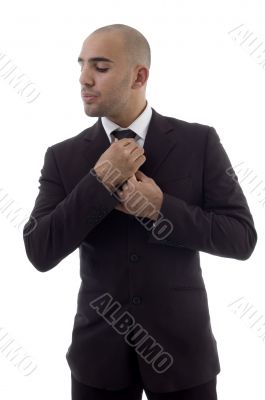 young accountant adjusting his tie