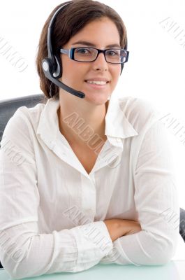 woman with headset and folded hands