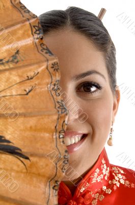 smiling face of female covered with umbrella