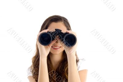smiling female watching through binocular