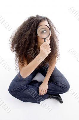 latin american female holding magnifier