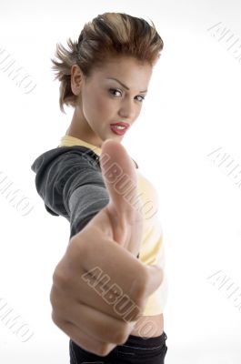 glamorous woman showing good luck sign