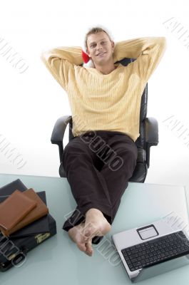 male in relaxing mode with legs on desk