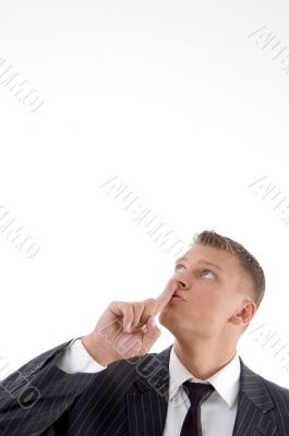 portrait of businessman asking to keep silent