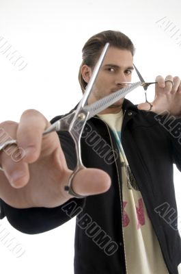 hair stylist holding a pair of scissors hair stylist holding a pair of scissors