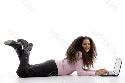 young hispanic female busy working on laptop