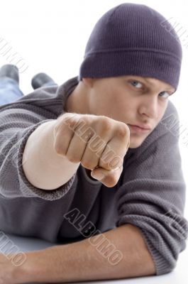 handsome model with winter cap showing punch