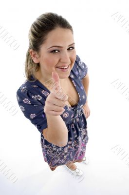 high angle view of young girl showing thumb up