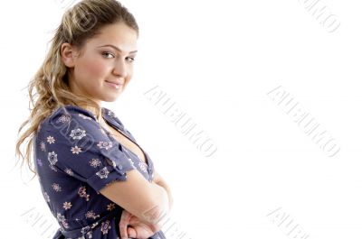 side view of smiling young girl with crossed arms