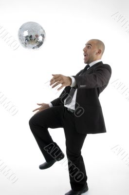 young corporate man playing with disco ball young corporate man playing with disco ball