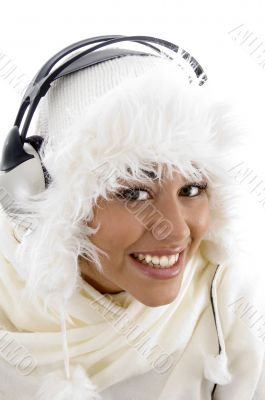 girl wearing winter clothes and listening to music