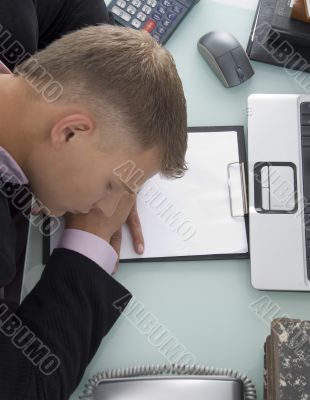 high angle view of sleeping young lawyer