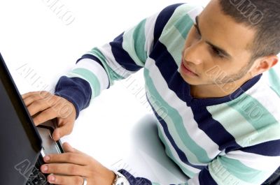 teenager guy working on laptop