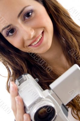 young female holding handy cam