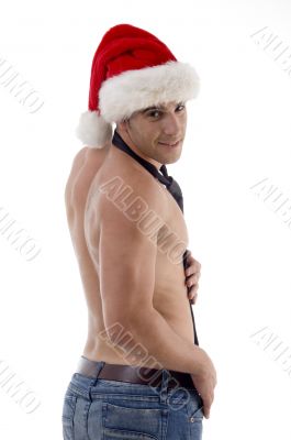 shirtless male model posing with christmas hat