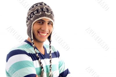 smiling boy covering his head with woolen cap