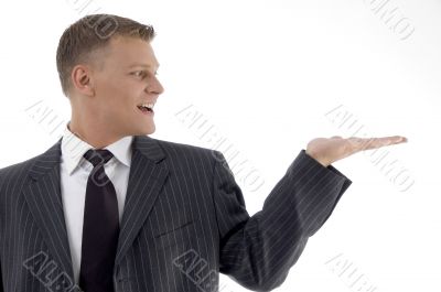 smiling adult businessman looking his palm
