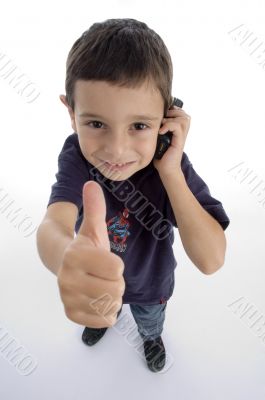  boy busy on phone call and showing thumbs up