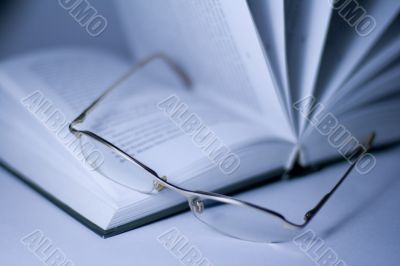 opened book and glasses