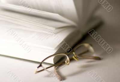 opened book and glasses