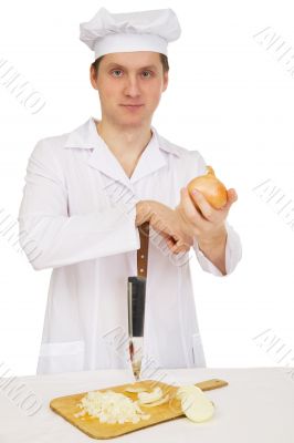 Cook with knife and preparation board