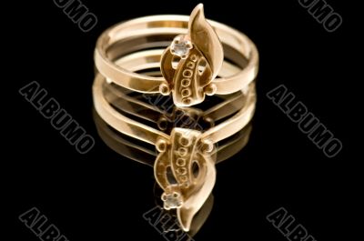 Gold ring on black