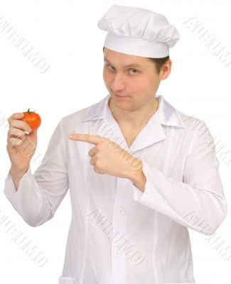 Cook with tomato in hand