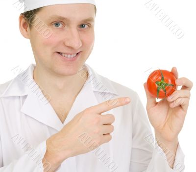 Cook with tomato in hand
