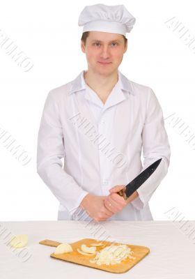 Cook with knife and preparation board