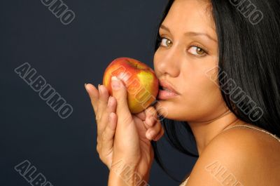 Beautiful exotic woman with apple