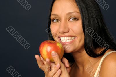 Beautiful exotic woman with apple