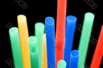 drinking straw on black macro