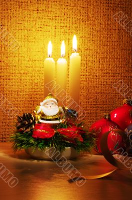 Santa in candles light and christmas ball
