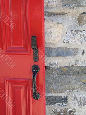 red door on a stone wall
