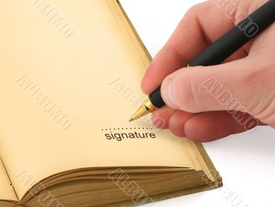 hand writing a signature