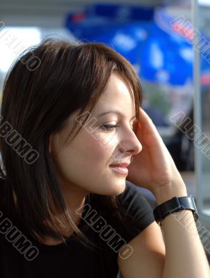 cute girl outdoor side view portrait hands on head