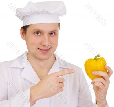 Cook with yellow paprica in hand