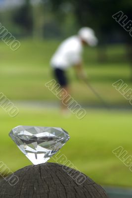 Diamond and golfer on green