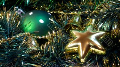 Green cristmas ball and golden star