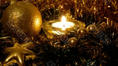 Golden xmas ball in candle light