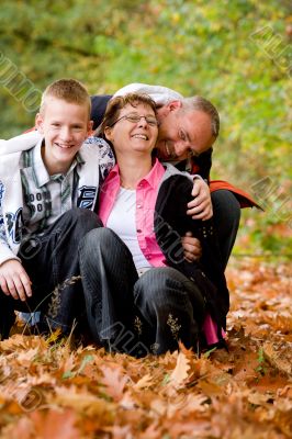Happy family is having fun in the autumn Happy family is having fun in the autumn