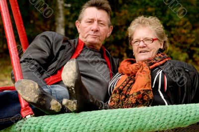 Older couple on the swing