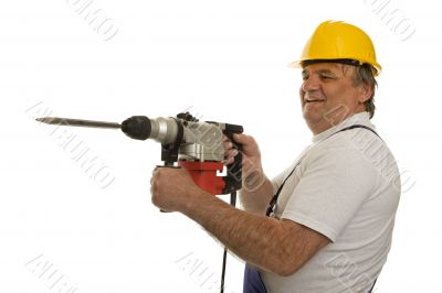 Worker with drilling machine and safety helmet Worker with drilling machine and safety helmet