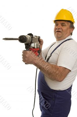 Worker with drilling machine and safety helmet Worker with drilling machine and safety helmet